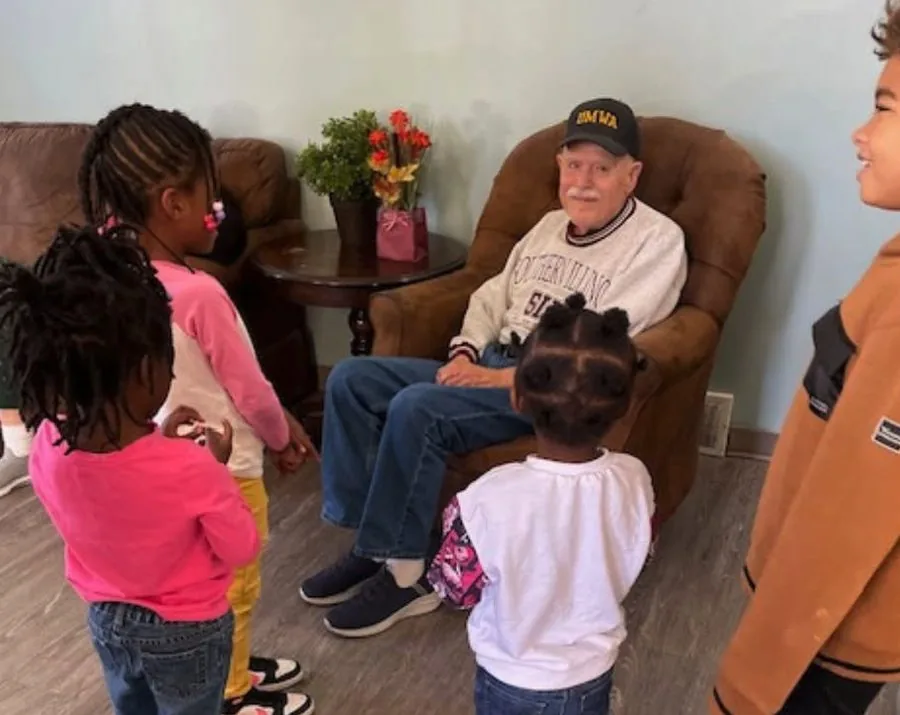 Children visiting a resident at Century Assisted Living